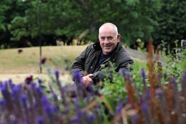 Councillor Ernest Gibson is urging residents to support their local parks this summer.