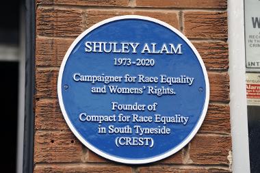 The blue plaque to Shuley Alam on the CREST building in Fowler Street, South Shields