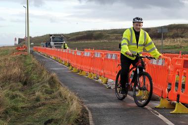 Cllr Ernest Gibson sees work begin on improvements to the coastal cycle route at Marsden